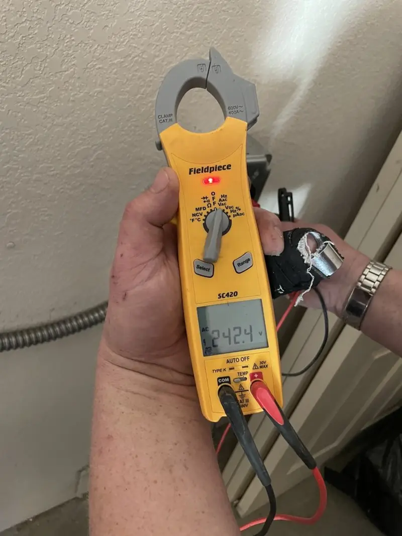 Voltage testing with clamp meter during Outlet Installation in Lyndhurst